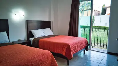 Cama o camas de una habitación en Hotel Osalle Inn