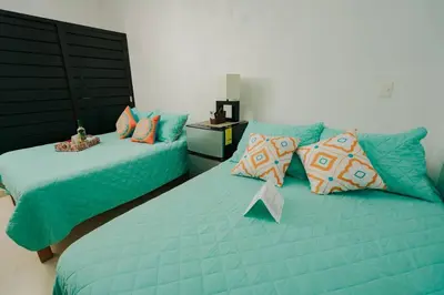 Cama o camas de una habitación en Casa entera Alberca en Acapulco Diamante