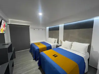 Cama o camas de una habitación en Hotel GALENO