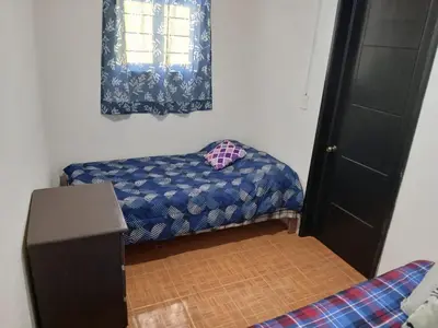 Cama o camas de una habitación en CASA ACOGEDORA