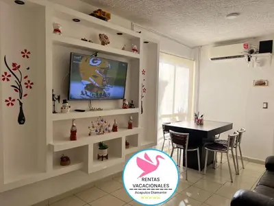 Una televisión o centro de entretenimiento en Depa Acapulco diamante alberca wifi