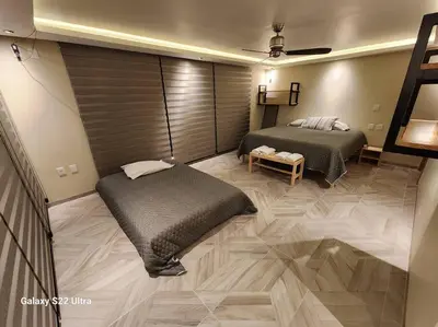 Cama o camas de una habitación en Casa Beily con alberca climatizada