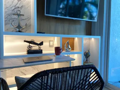 Una televisión o centro de entretenimiento en Depto acogedor en Acapulco Diamante - Sin daños por OTIS