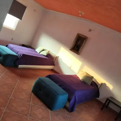 Cama o camas de una habitación en Casa Colibrí Ahuatepec Cuernavaca