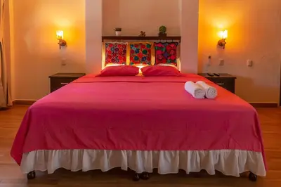 Cama o camas de una habitación en Oasis Maya