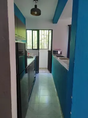Una cocina o zona de cocina en Departamento Familiar Escorpións
