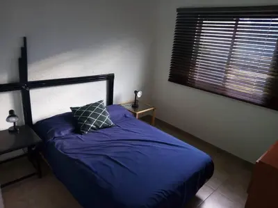 Cama o camas de una habitación en Casa Azul en la orilla del Lago Tequesquitengo