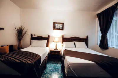 Cama o camas de una habitación en Hostal Plaza Central
