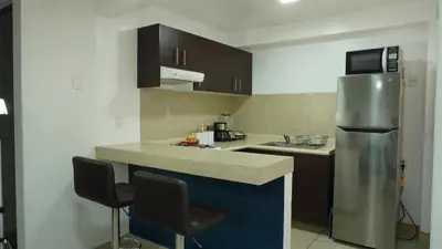 Una cocina o zona de cocina en Depa Balcones cerca Estadio GNP, Palacio de los Deportes, Autódromo HR y Aeropuerto CDMX