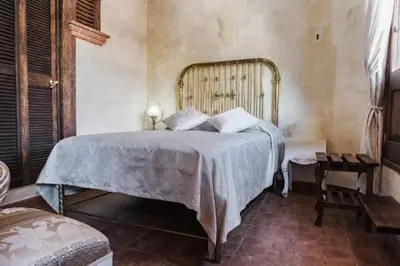 Cama o camas de una habitación en Hotel Na-anché Aeropuerto