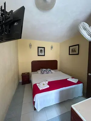 Cama o camas de una habitación en Hotel Capri Playa a una calle de la Playa Regatas
