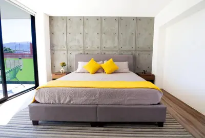 Cama o camas de una habitación en KUKO SUITES
