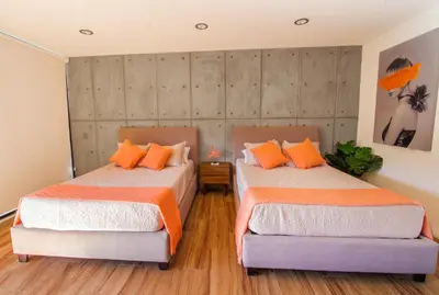 Cama o camas de una habitación en KUKO SUITES