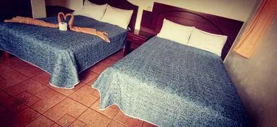 Cama o camas de una habitación en hotel posada los dominicos