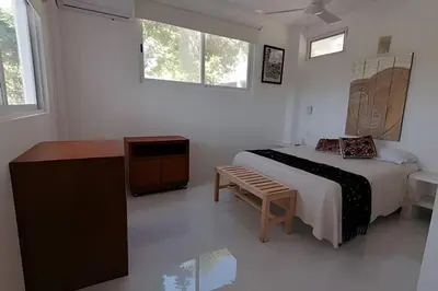 Cama o camas de una habitación en Valentina Salchi Buda depa playa virgen internet