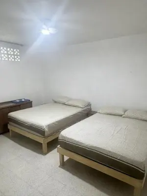 Cama o camas de una habitación en Recamaras Acuario Veracruz planta alta RESERVA whats 228ll5476O NO RESERVAS AQUI