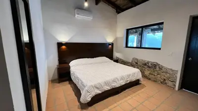 Cama o camas de una habitación en La Peña Hotel Boutique & SPA
