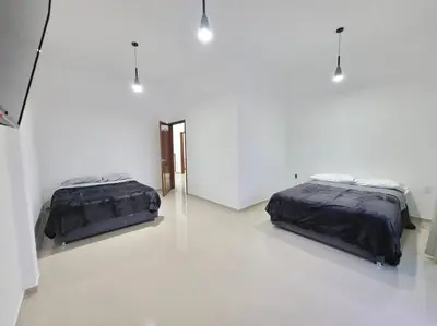Cama o camas de una habitación en Casa MORA Tequesquitengo