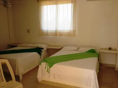 Cama o camas de una habitación en QUINTA DIAMANTE Barra Vieja