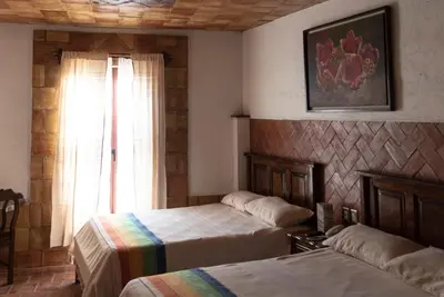 Cama o camas de una habitación en Hotel Casa Mixteca