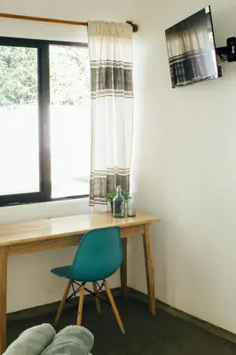 Una televisión o centro de entretenimiento en Casa Kâi