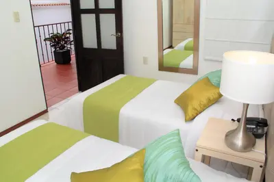 Cama o camas de una habitación en Hotel La Casa de María