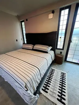 Cama o camas de una habitación en Lofts Marques Oaxaca