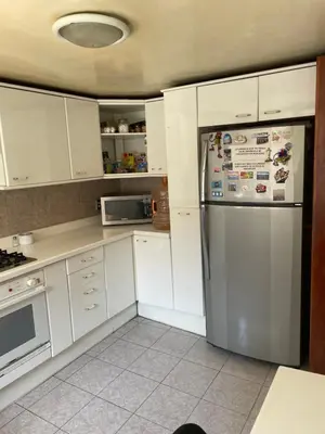 Una cocina o zona de cocina en Habitación con baño compartido