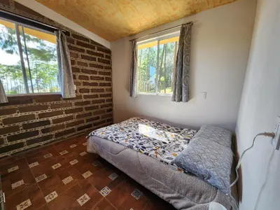 Cama o camas de una habitación en Chalet Bosque de Zacatlan II