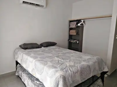 Cama o camas de una habitación en Bonito departamento planta baja en zona diamante