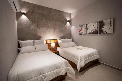 Cama o camas de una habitación en Aurora Hotel Boutique