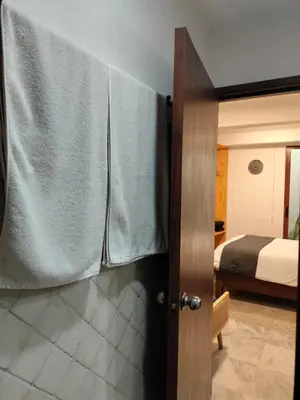 Cama o camas de una habitación en CHOLULA SUITES