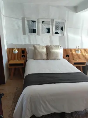 Cama o camas de una habitación en CHOLULA SUITES