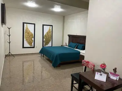 Cama o camas de una habitación en HOTEL OTOMI