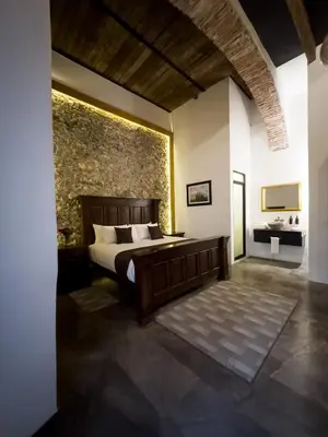 Cama o camas de una habitación en HOTEL BOUTIQUE CASONA 65