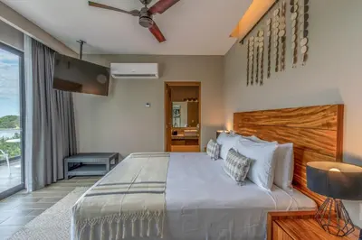 Cama o camas de una habitación en Nirú Ocean Suites by Binniguenda