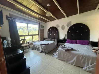 Cama o camas de una habitación en La Palapa & Posada Mía