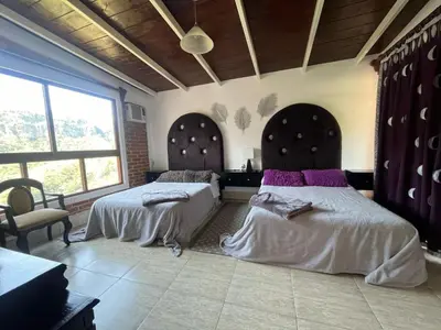 Cama o camas de una habitación en La Palapa & Posada Mía