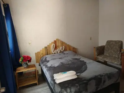 Cama o camas de una habitación en Departamento cómodo y céntrico en Malinalco.