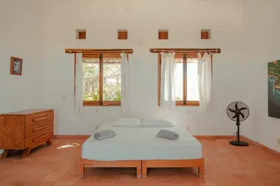 Cama o camas de una habitación en Casa de playa El Cortijo
