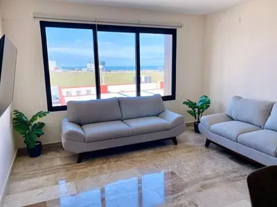 Zona de estar de Dpto C-alberca Playa La Bamba - Facturamos