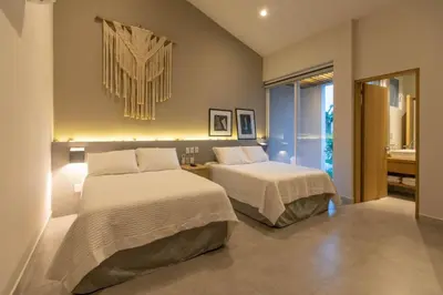 Cama o camas de una habitación en Casa Yoo tu oasis de lujo en Huatulco