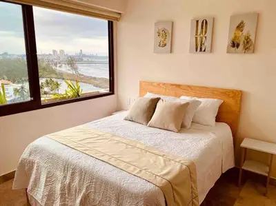 Cama o camas de una habitación en 9nopiso Vista al Mar con 3 Albercas con Gym y Playa