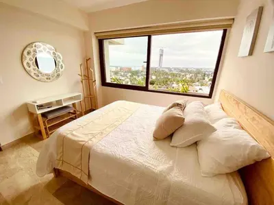 Cama o camas de una habitación en 9nopiso Vista al Mar con 3 Albercas con Gym y Playa