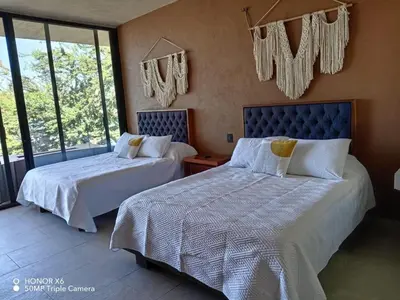 Cama o camas de una habitación en Quinta Guamuchil Acceso lago