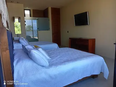 Cama o camas de una habitación en Quinta Guamuchil Acceso lago