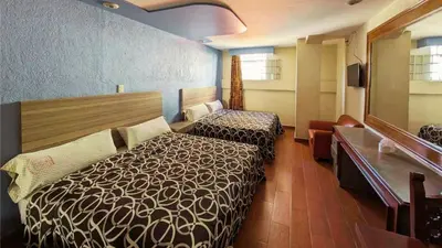 Cama o camas de una habitación en Hotel Plaza San Juan