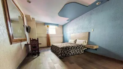 Cama o camas de una habitación en Hotel Plaza San Juan