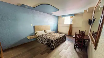 Cama o camas de una habitación en Hotel Plaza San Juan