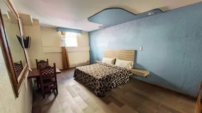 Cama o camas de una habitación en Hotel Plaza San Juan
